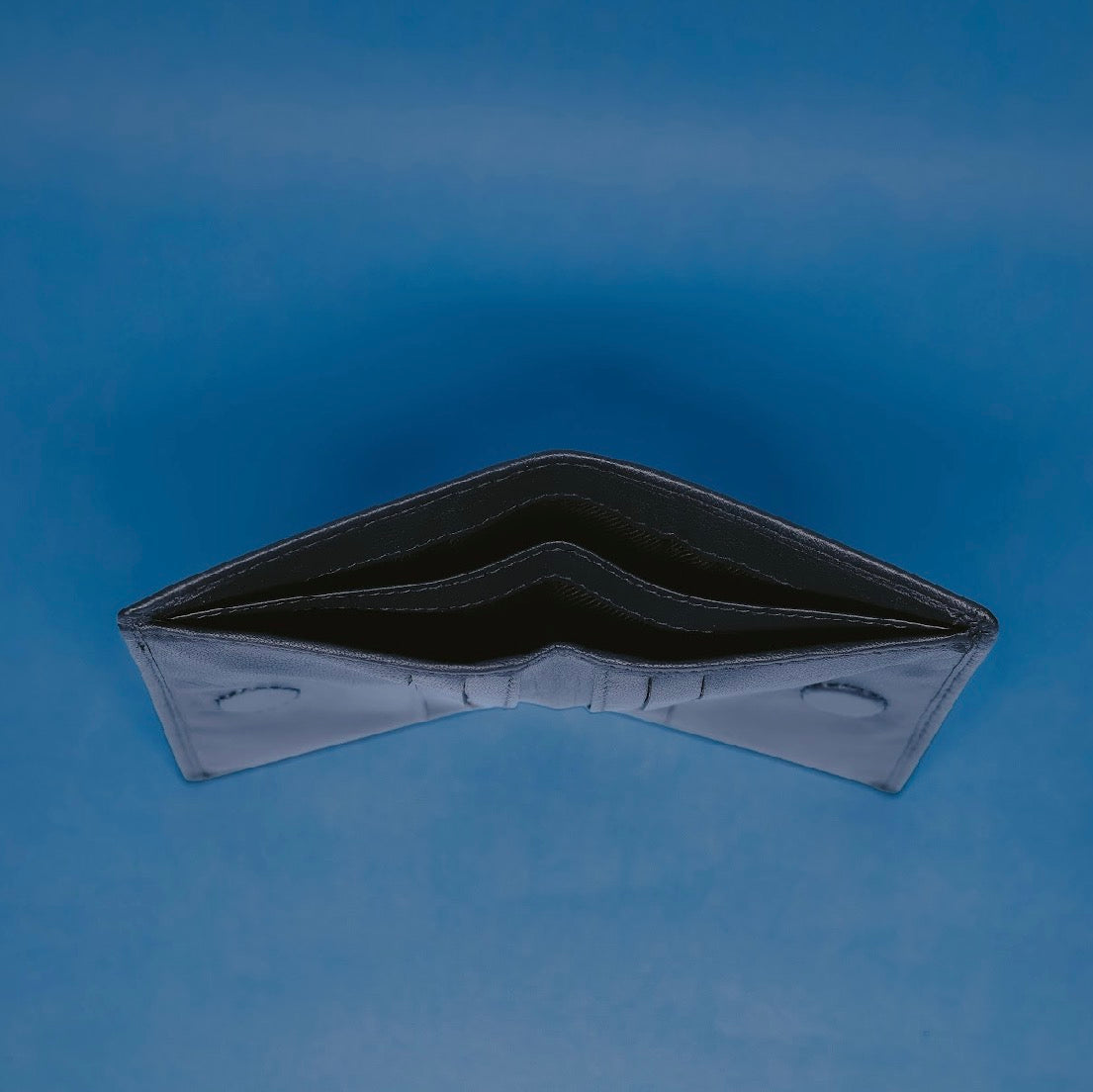 MoonVoyage leather pocket organizer wallet featuring a moonlit mountain lake design by STELTH